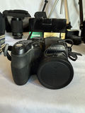 Assorted cameras, lenses, flash, and tripods - thumbnail 7 of 16