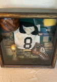 Sports memorabilia collection: baseball gear and soccer display - thumbnail 3 of 6