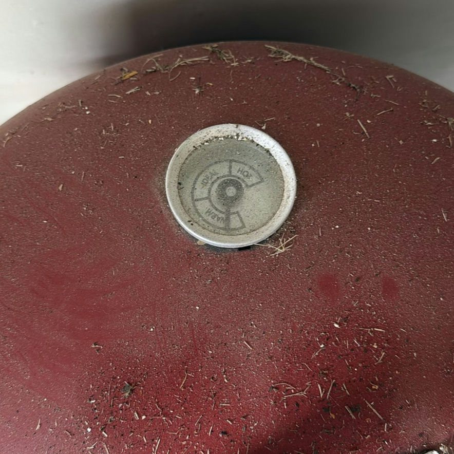 Red barrel-style smoker with wood chunks - image 3 of 5