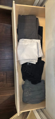 Assorted pants and jeans in a dresser drawer - Image 1 of 6