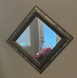 Decorative mirrors, butterfly wall art, and floral basket arrangement - thumbnail 2 of 6