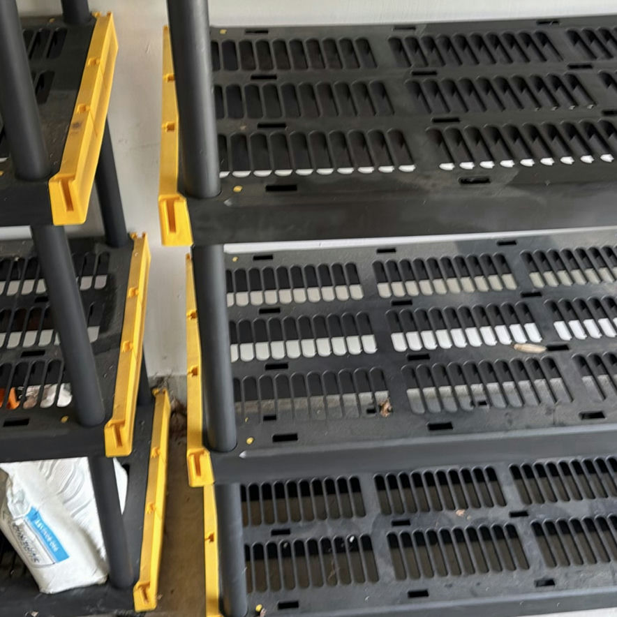 Black multi-tier shelving units with yellow corner brackets - image 4 of 5