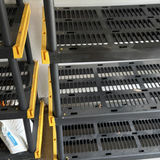 Black multi-tier shelving units with yellow corner brackets - thumbnail 4 of 5