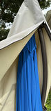 Patio umbrella with blue canopy and beige protective cover - thumbnail 4 of 6
