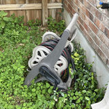 Wheeled garden hose reel with coiled hose - thumbnail 1 of 4