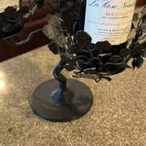 Two wine bottles in a metal leaf candelabra centerpiece - thumbnail 2 of 5