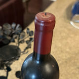 Two wine bottles in a metal leaf candelabra centerpiece - thumbnail 4 of 5