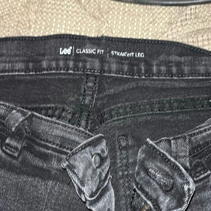 Assorted pants and jeans in a dresser drawer - image 5 of 6