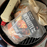 Red barrel-style smoker with wood chunks - thumbnail 4 of 5