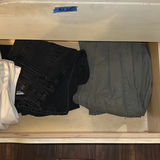 Assorted pants and jeans in a dresser drawer - thumbnail 3 of 6