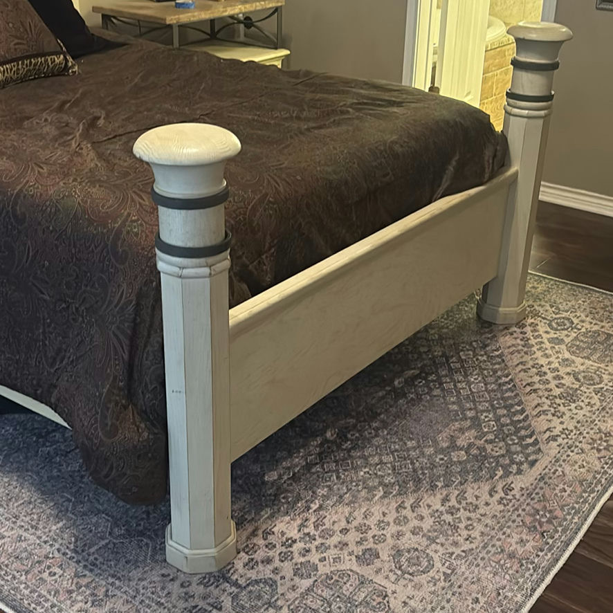 Cream four-poster bed with wrought-iron headboard and circular wall art - image 3 of 11
