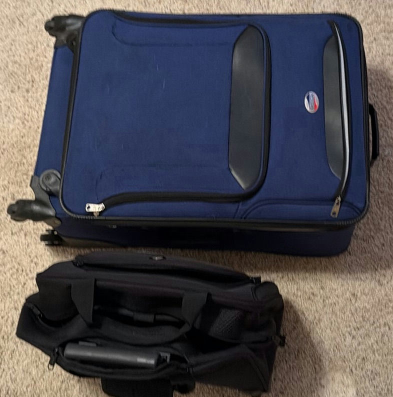 Blue Olympia rolling suitcase with black carry-on bag and iron - image 1 of 6