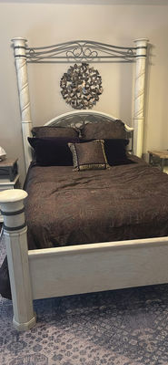 Cream four-poster bed with wrought-iron headboard and circular wall art - Image 1 of 11