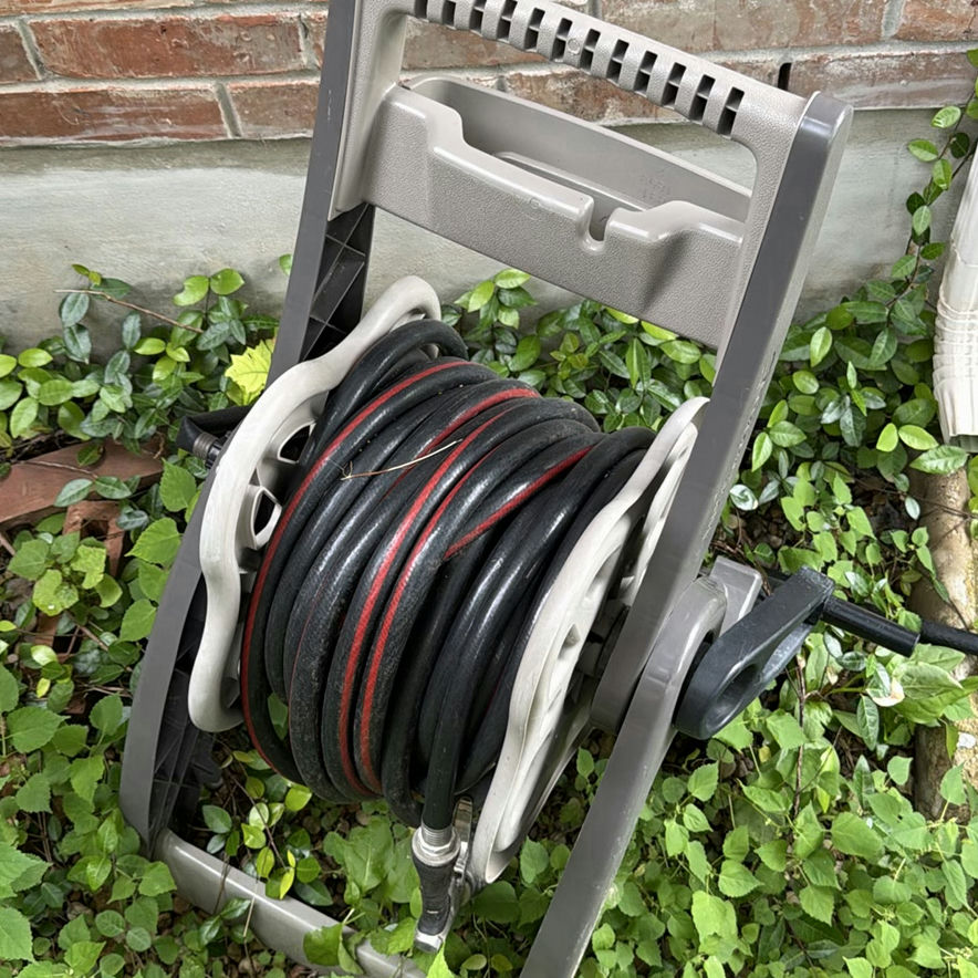 Wheeled garden hose reel with coiled hose - image 2 of 4