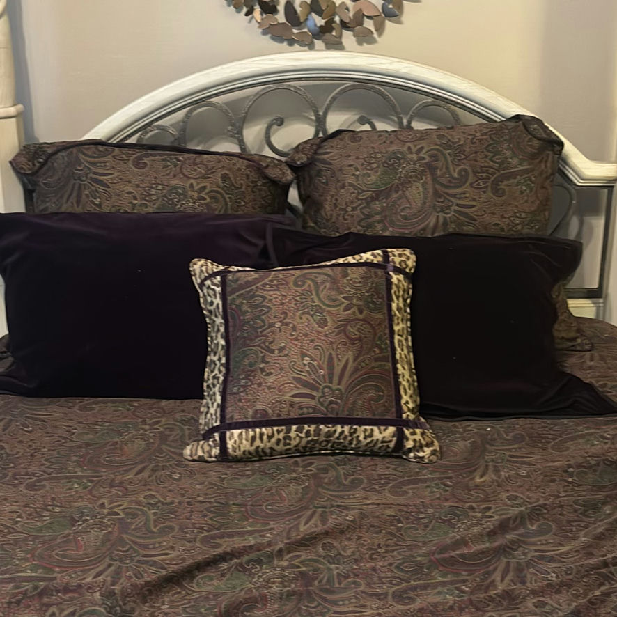 Cream four-poster bed with wrought-iron headboard and circular wall art - image 7 of 11