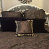 Cream four-poster bed with wrought-iron headboard and circular wall art - thumbnail 7 of 11