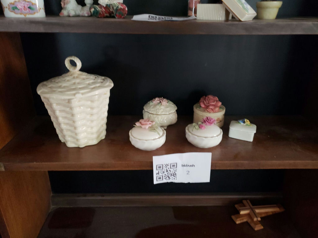 Ceramic lidded boxes and a basket-pattern container - image 1 of 3