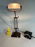 Industrial adjustable desk lamp with frosted shade and vintage metronomes. - thumbnail 1 of 5