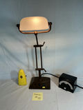 Industrial adjustable desk lamp with frosted shade and vintage metronomes. - thumbnail 5 of 5