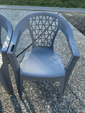 Two gray plastic patio chairs with lattice backs and two round tables (mesh and glass-top) - thumbnail 3 of 3