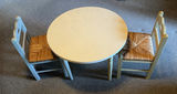 Child-sized round table with two woven-seat chairs - thumbnail 1 of 8