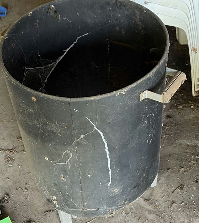 Stack of white plastic chairs and a black cylindrical metal trash can - image 4 of 4