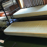 Metal bunk beds with striped mattresses - thumbnail 2 of 7