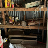 Cluttered shed with microwave, cabinets, screens and miscellaneous hardware - thumbnail 5 of 7