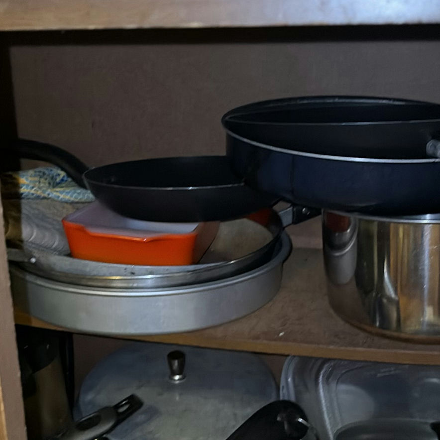 Assorted cookware and enamelware in a cabinet - image 5 of 10