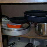 Assorted cookware and enamelware in a cabinet - thumbnail 5 of 10