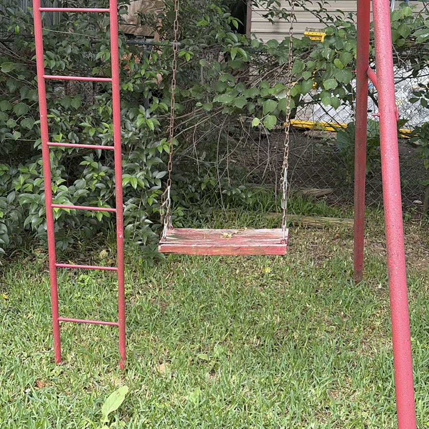 Red metal playground swing set with multiple swings and gym rings - image 3 of 5