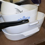 Assorted cookware and enamelware in a cabinet - thumbnail 9 of 10