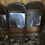 Stacked metal folding chairs - thumbnail 5 of 6