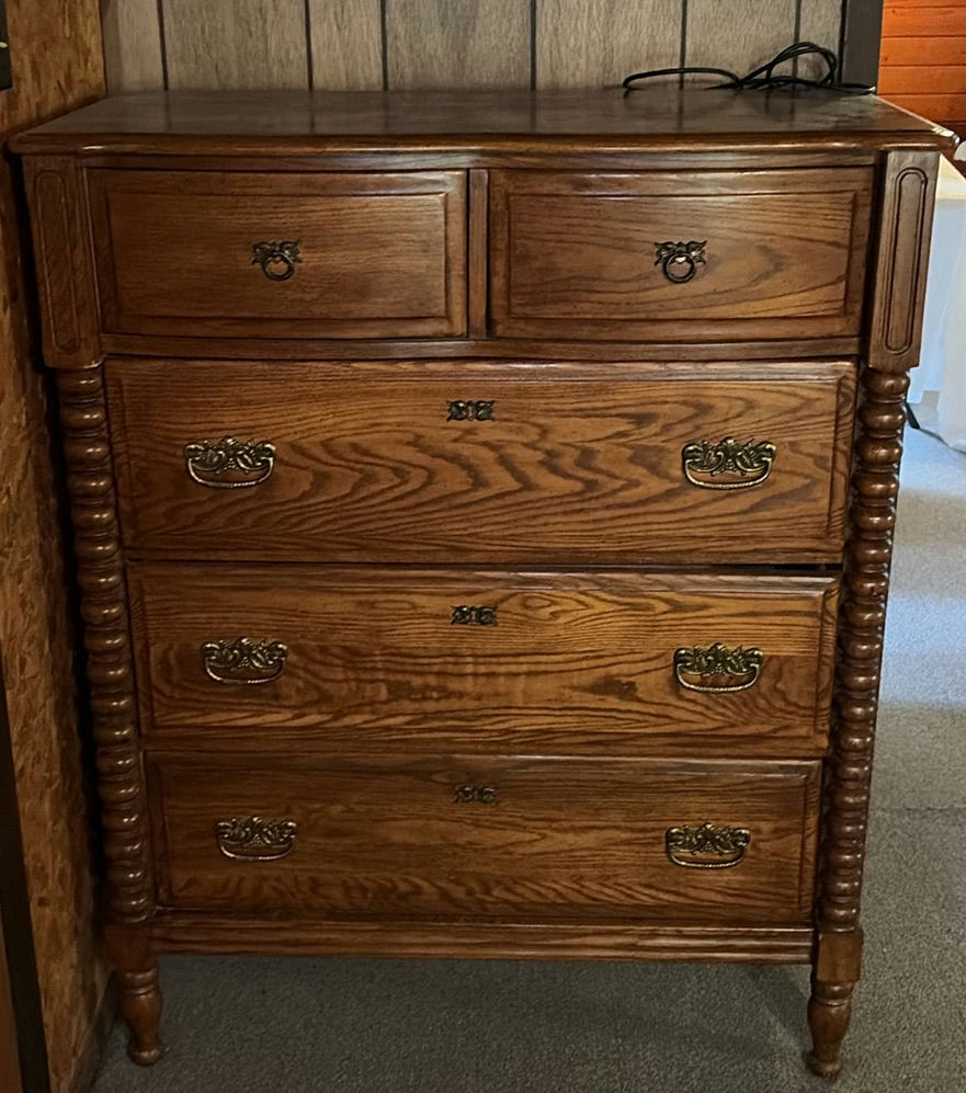 Oak dresser with multiple drawers and ornate hardware - image 1 of 6