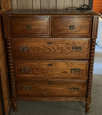 Oak dresser with multiple drawers and ornate hardware - Image 1 of 6