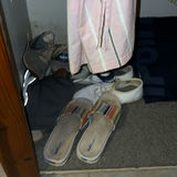 Closet with hanging clothes and footwear - thumbnail 2 of 4