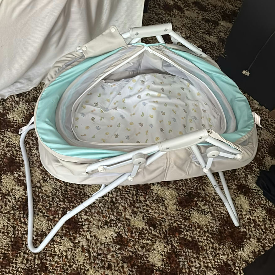 Foldable baby bassinet/rocker with bedding and accessories - image 5 of 9