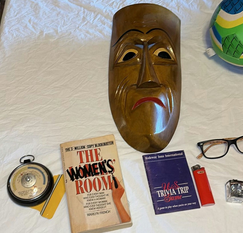 Assorted items: carved wooden mask, barometer, books, glasses, lighter, cushions, ball and circular object - image 2 of 8