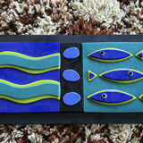 Abstract three-panel wall sculpture with wavy bands and fish motifs - thumbnail 2 of 4