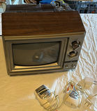 Vintage GE wood-veneer CRT television with two VTech handheld devices - thumbnail 1 of 6