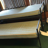 Metal bunk beds with striped mattresses - thumbnail 1 of 7