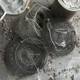 Assorted round wire mesh traps and a landing net - thumbnail 2 of 4