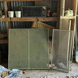Cluttered shed with microwave, cabinets, screens and miscellaneous hardware - thumbnail 3 of 7