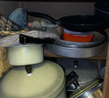 Assorted cookware and enamelware in a cabinet - thumbnail 3 of 10