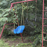Red metal playground swing set with multiple swings and gym rings - thumbnail 4 of 5