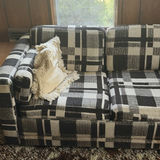 Plaid sleeper sofa with cushions and floral sheet - thumbnail 2 of 5