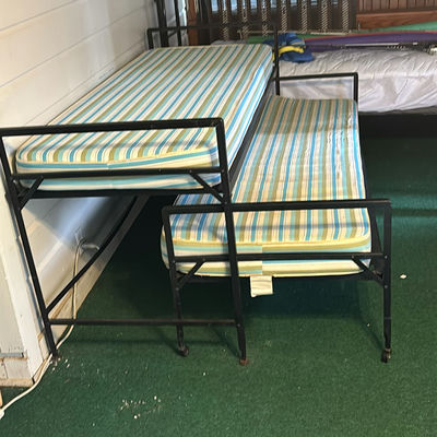 Metal bunk bed frames with striped twin mattresses - Image 1 of 3