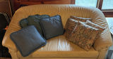 Beige leather sofa and love seat with blue and patterned throw pillows - thumbnail 5 of 7