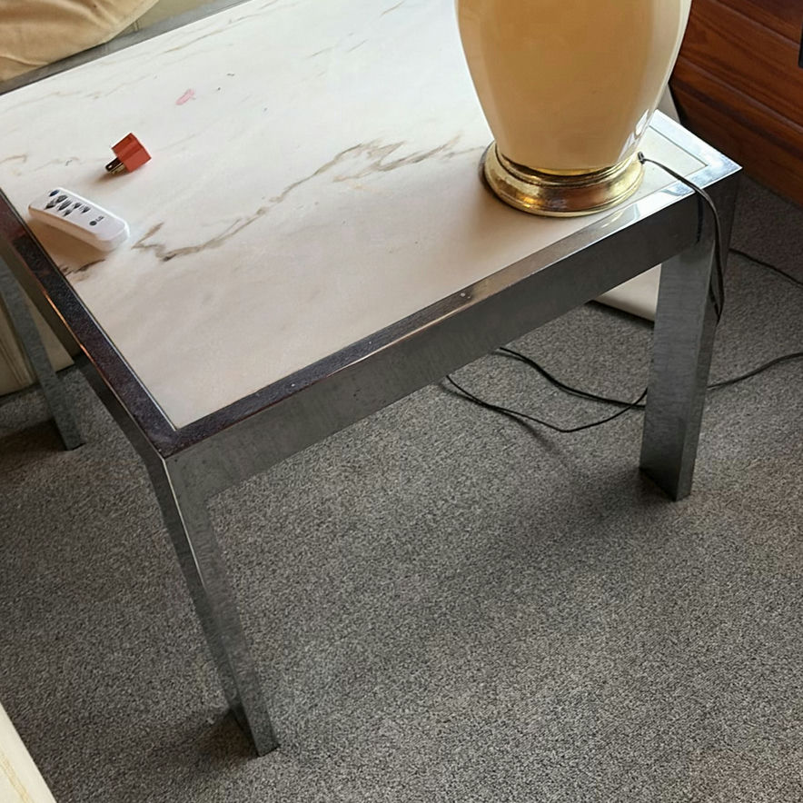 Beige ceramic table lamp with pleated shade on marble-top end table - image 3 of 5