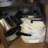 Assorted cookware and enamelware in a cabinet - thumbnail 6 of 10